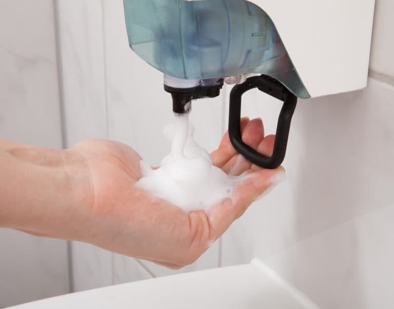 Hand sanitizer dispenser in a clean recreation facility